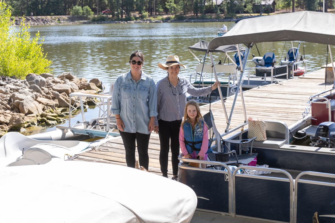 Liz and Chuck Engelhart standing together on the dock at Rainbow's End