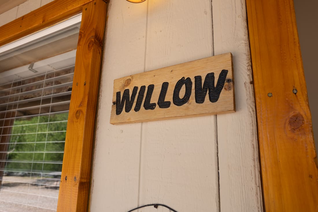The hand-painted Willow sign on the cottage door