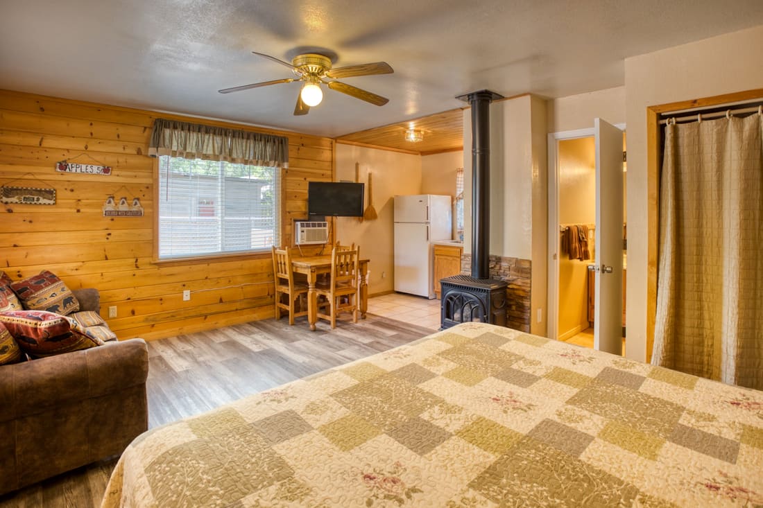 Elm cottage bedroom with knotty pine walls