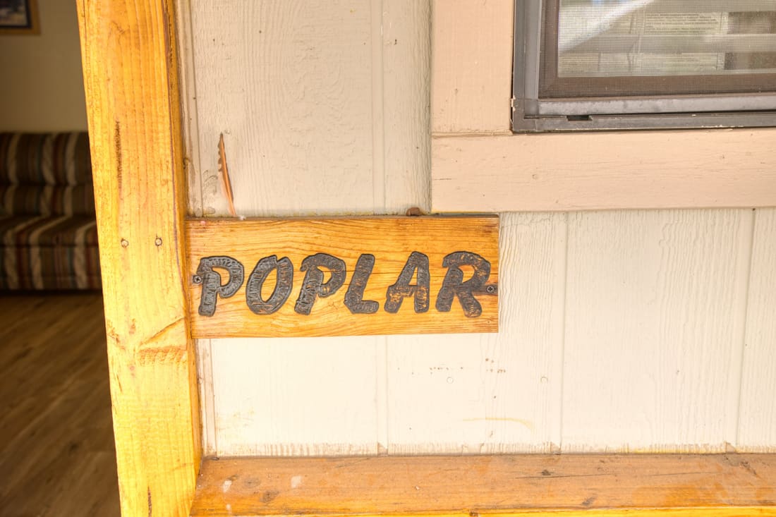 The hand-painted Poplar sign on the cottage door